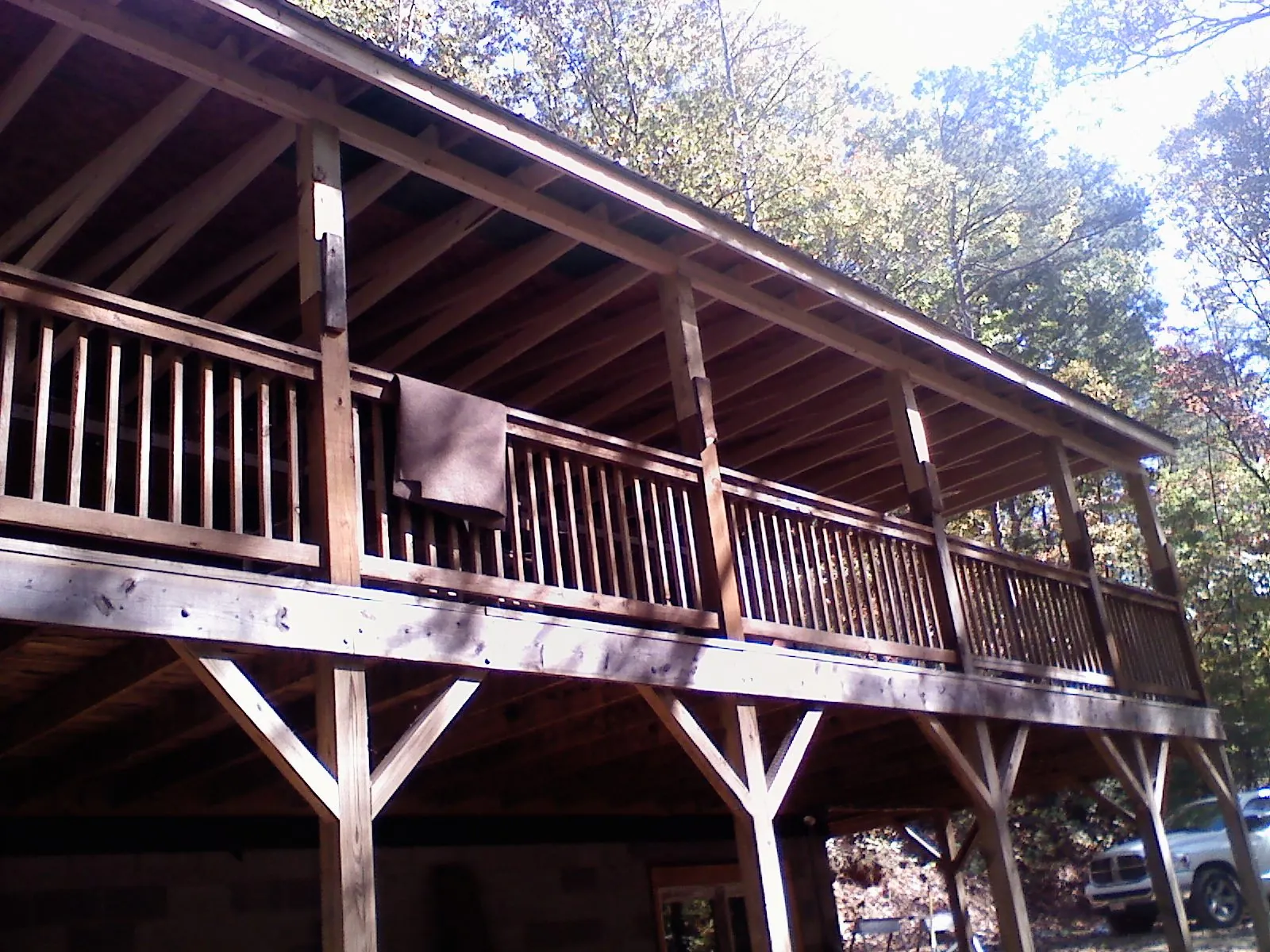 Timber framing under a new elevated porch and deck in Pine Mountain